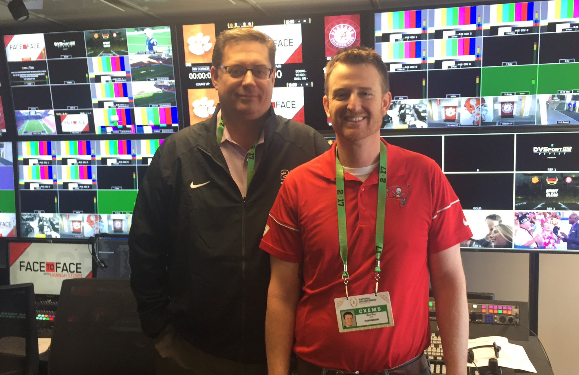 VWSE Productions' Bob Becker (left) and the Tampa Bay Buccaneers' Dan Roy inside Raymond James Stadium's new control room prior to the start of the 2017 College Football Playoff National Championship Game.