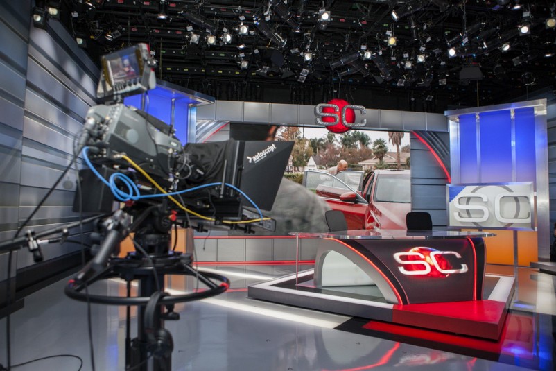A custom-made curved HD screen dominates the SportsCenter set.