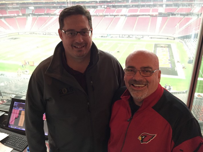 Bob Becker, SVP of Van Wagner Sports and Entertainment with Mike Conner, director of video board and event production for the Arizona Cardinals inside the video control room at University of Phoenix Stadium. 
