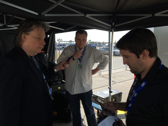 SVG’s Dan Daley (left) gets a primer on VR for NASCAR at the NextVR’s Daytona 500 encampment from NextVR’s Matt Amick (right) as Fox Sports’ Michael Davies looks on.