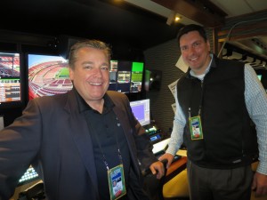 SMT's Gerard Hall (left) and Don Tupper in front of the SMT system that is changing the way stats, video, and data are coming together.