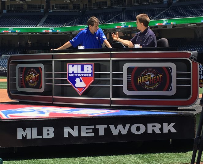 MLB Network primary set, which is wheeled on and off the field on a golf cart, is on the third-base line.