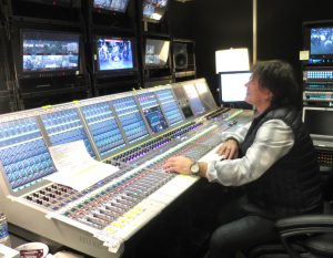 Peteris Saltans, freelance audio mixer for NFL Network, at work on a Calrec Artemis console.