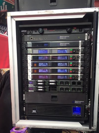 Professional Wireless Systems supplied this rack of 10 Shure Axient wireless channels, with Axient Spectrum Manager, Ethernet switch, and battery-charging docks.
