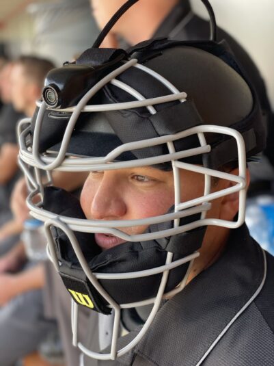 The UmpCam positioned on umpire face mask.